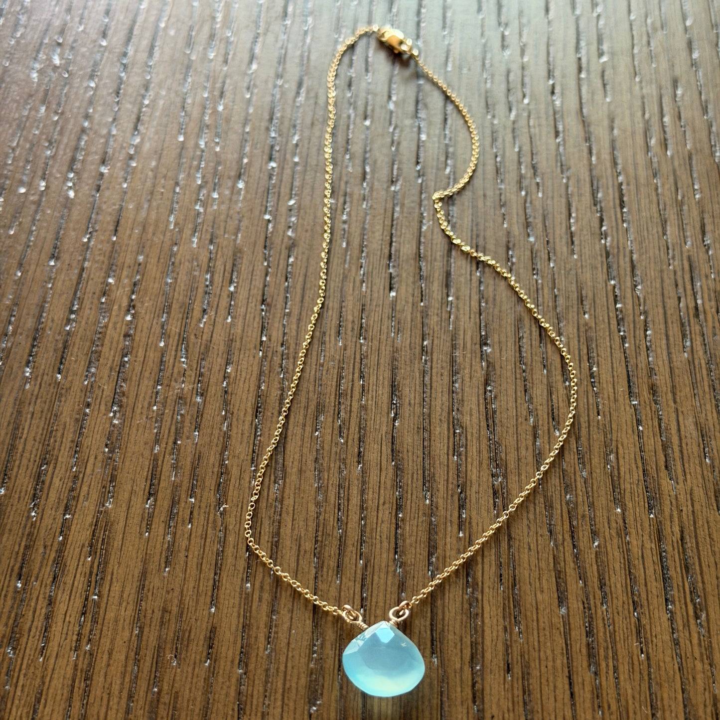 Blue chalcedony briolette necklace with 15-inch gold-filled chain and wire-wrapped teardrop stone